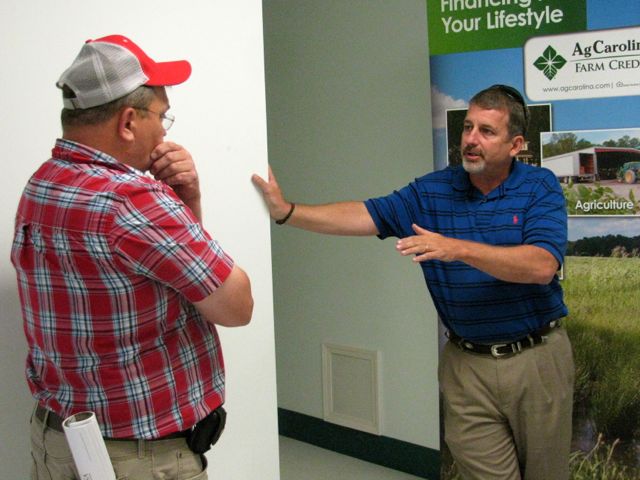 Greene County FSA officer speaks to a farmer at the RAFI Resource Rodeo